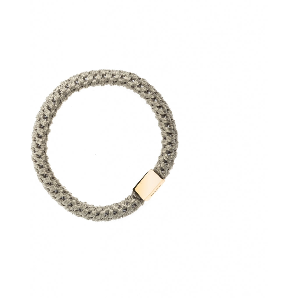 Dark Hårstrikk med gulldetalj