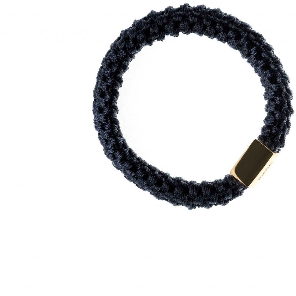 Dark Hårstrikk med gulldetalj