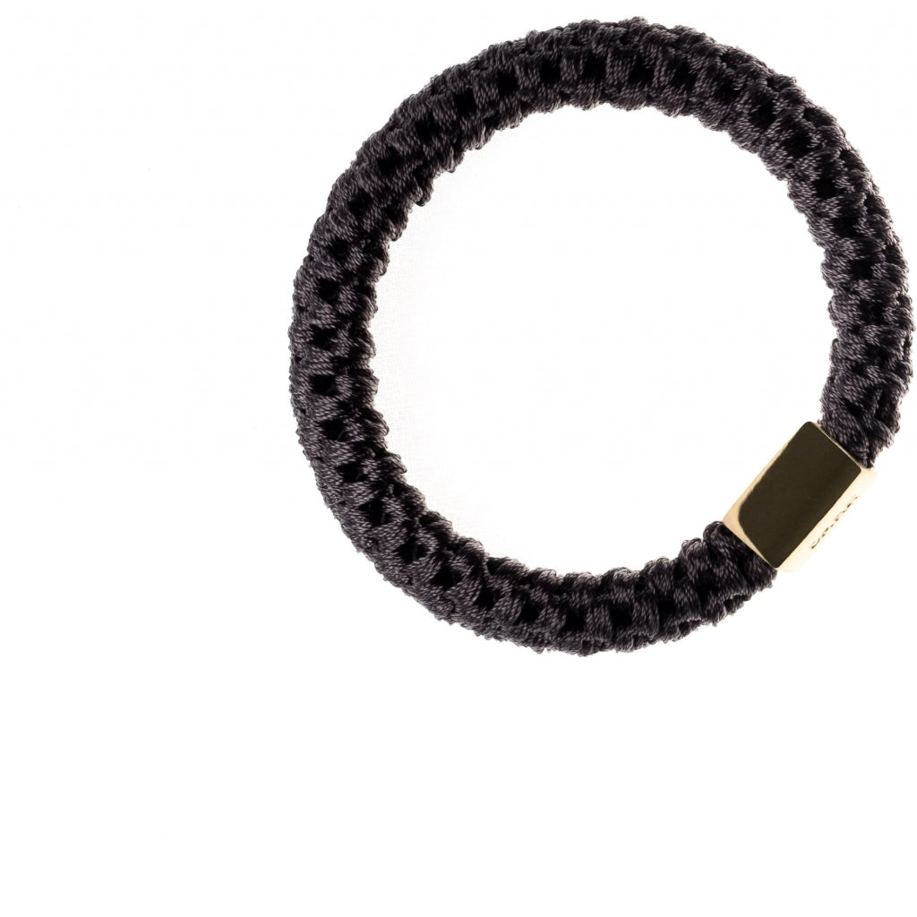 Dark Hårstrikk med gulldetalj